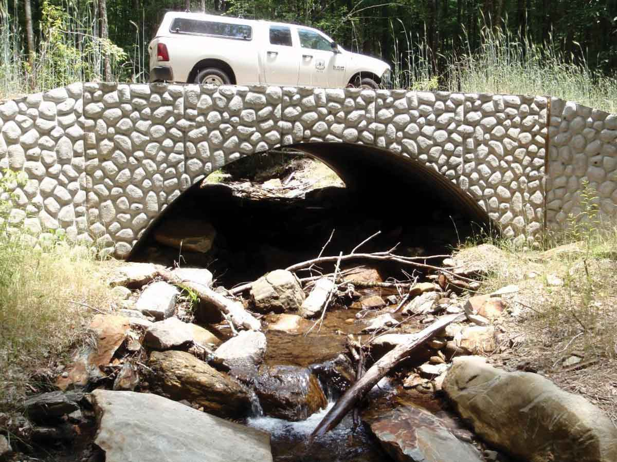 Bottomless arch culverts like this one on Buck Creek improve passage for fish and other aquatic organisms while reducing road maintenance. USFS photo
