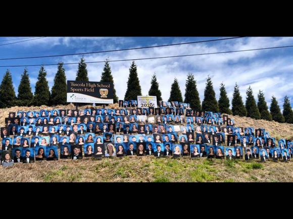 Graduate photos dot the hillside below Tuscola High School. Donated photo