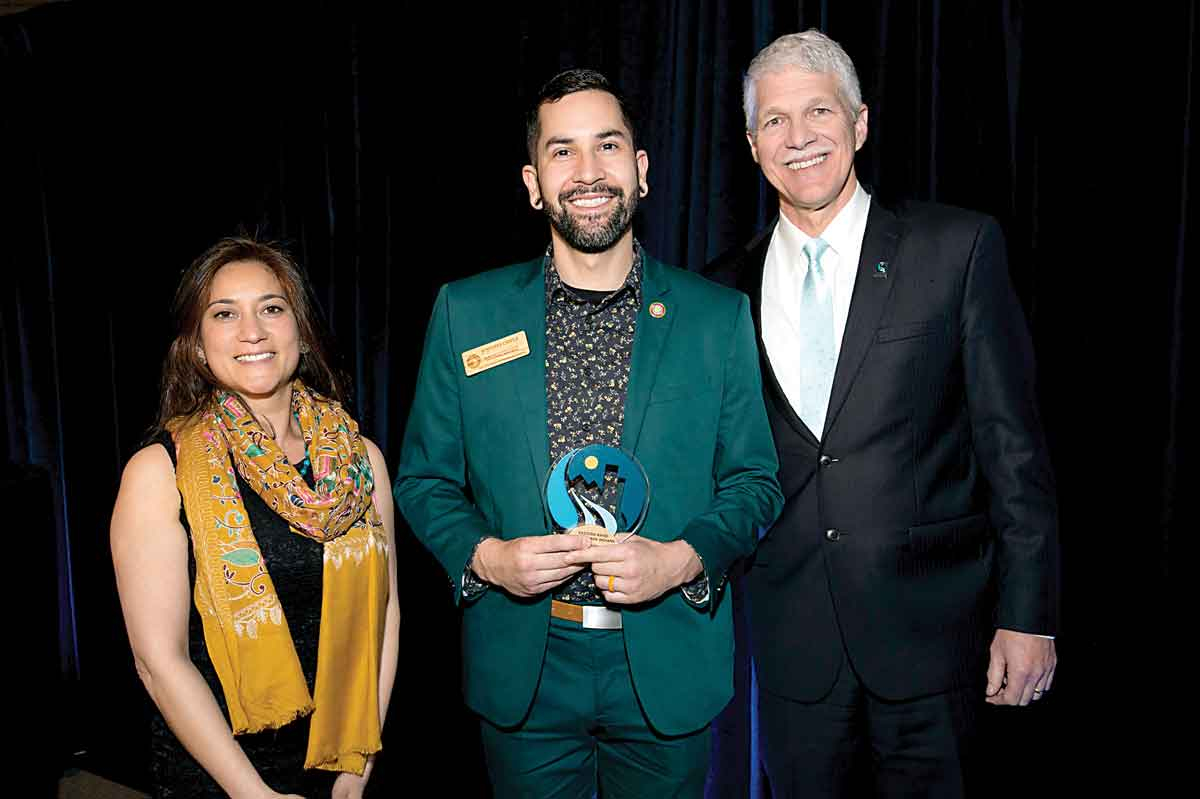 EBCI Secretary of Agriculture and Natural Resources Joey Owle stands with Tom Kiernan, President and CEO of American Rivers (right) and Board Member Chair Pallavi Phartiyal.