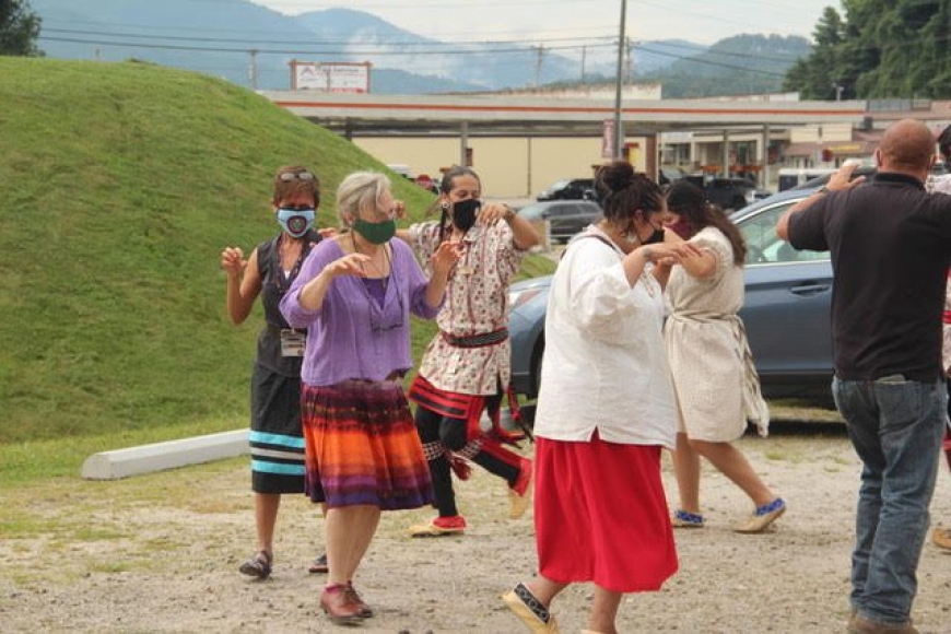 Nikwasi Initiative Executive Director, Elaine Eisenbraun, joins the Cherokee Culture Keepers in Bear Dance to celebrate groundbreaking at new Kiosk site.