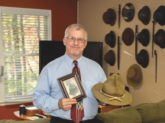 WCU music instructor Brad Ulrich poses with some items from his collection of WWI memorabilia. WCU photo