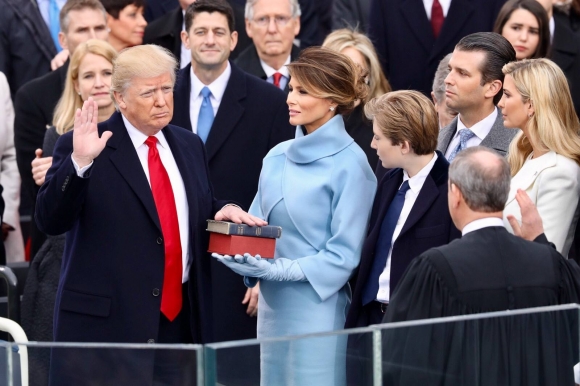 President Donald Trump (left) takes the oath of office