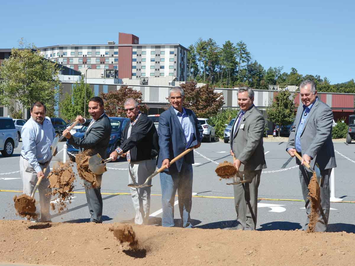Tribal and casino leaders (from left, Tribal Casino Gaming Commission Chair Tommy Lambert, Principal Chief Richard Sneed, Tribal Council Chairman Richard French, Vice Chief Alan &quot;B&quot; Ensley, Valley River Casino General Manager Lumpy Lambert and Harrah’s Cherokee General Manager Brooks Robinson) break ground on the $275 million expansion project. Holly Kays photo
