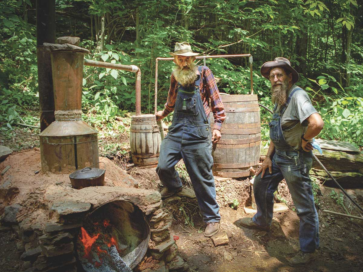Popcorn Sutton (center) remains a folk hero to some, and an outlaw to others. Neal Hutcheson photo.