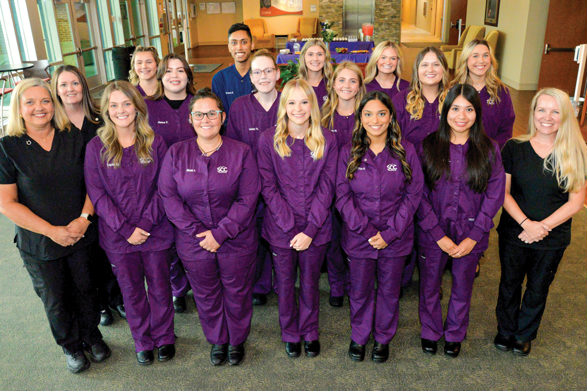 Members of SCC’s first Dental Assisting class are pictured here with their instructors. Front row, from left: Instructor Kristy Lance, Kayla McEntire of Sylva, Nicole Toner of Whittier, Emily Pilkerton of Franklin, Diya Patel of Sylva, Ashley Lopez of Franklin and Abra Brooks, SCC’s Dental Hygiene Program Coordinator. Middle row, from left: SCC instructor Jeniffer Nicholson, Awee French of Dillsboro, Haley Henderson of Franklin, Kelle Williams of Robbinsville, and Kaylee Cornelius of Murphy. Back row: Madeline Potts of Cashiers, Akram Patel of Sylva, Kaitlyn Richmond of Sylva, Ansley Welch of Waynesville and Alexandria Trantham of Cullowhee. Donated photo