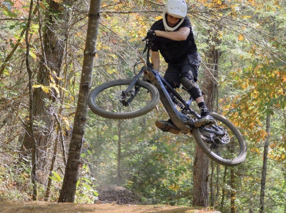 A biker takes a jump at a bike park similar to the one Asheville YouTuber Seth Alvo is building within Canton’s Chestnut Mountain Park. Seth Alvo photo
