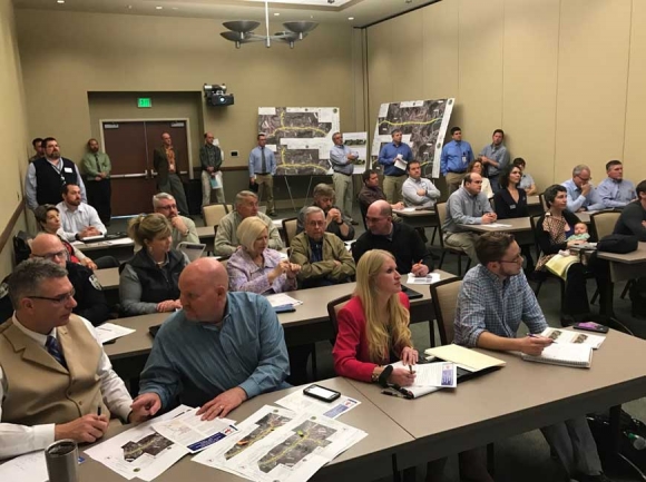 Town and county leaders gather for an information session on the N.C. 107 project in 2017. SMN photo