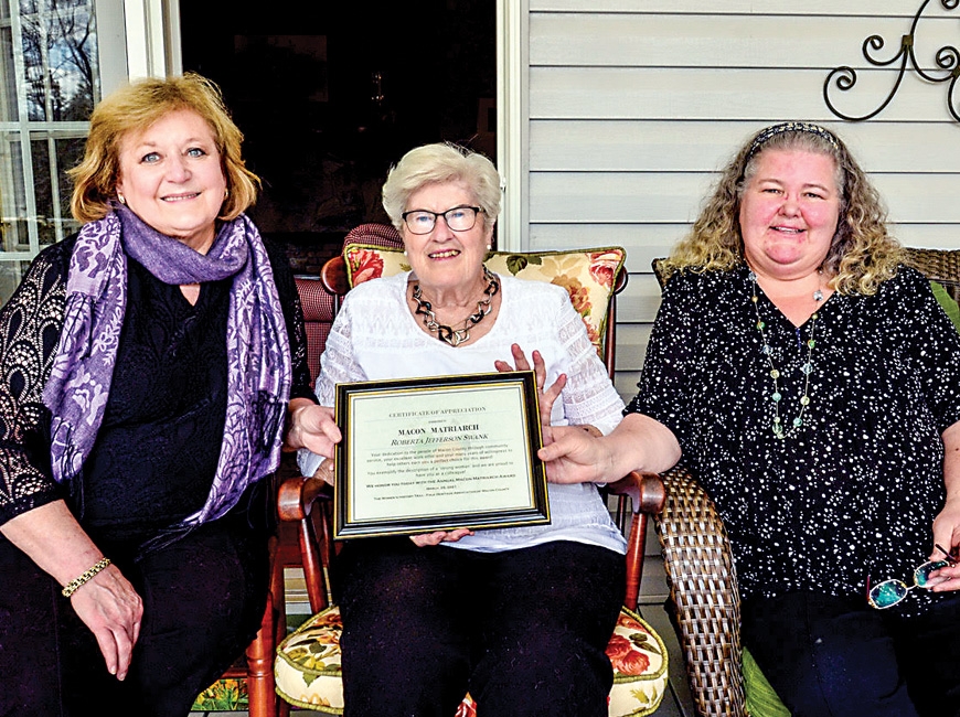 Roberta Swank (middle) is presented with the 2021 Macon Matriarch Award from Women’s History Trail members Anne Hyder (left) and Claire Claire Suminski. Karen Lawrence photo