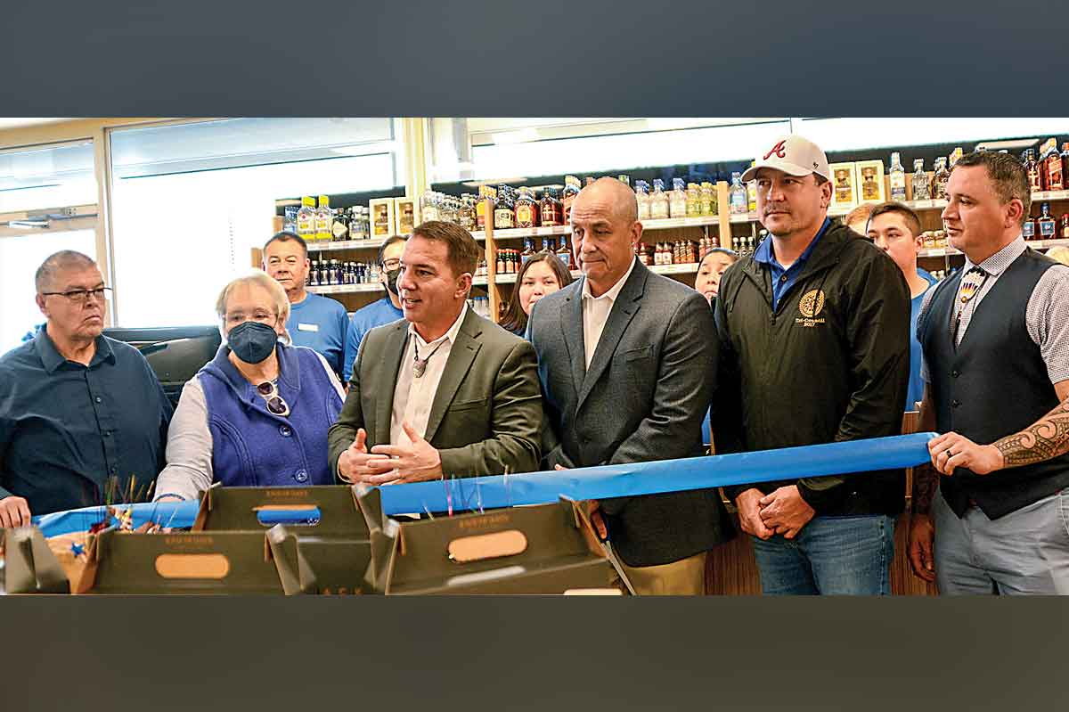 Pepper Taylor, third from right, stands with Principal Chief Richard Sneed and members of Tribal Council during a grand opening for the ABC Store Thursday, March 10, 2022. Holly Kays photo