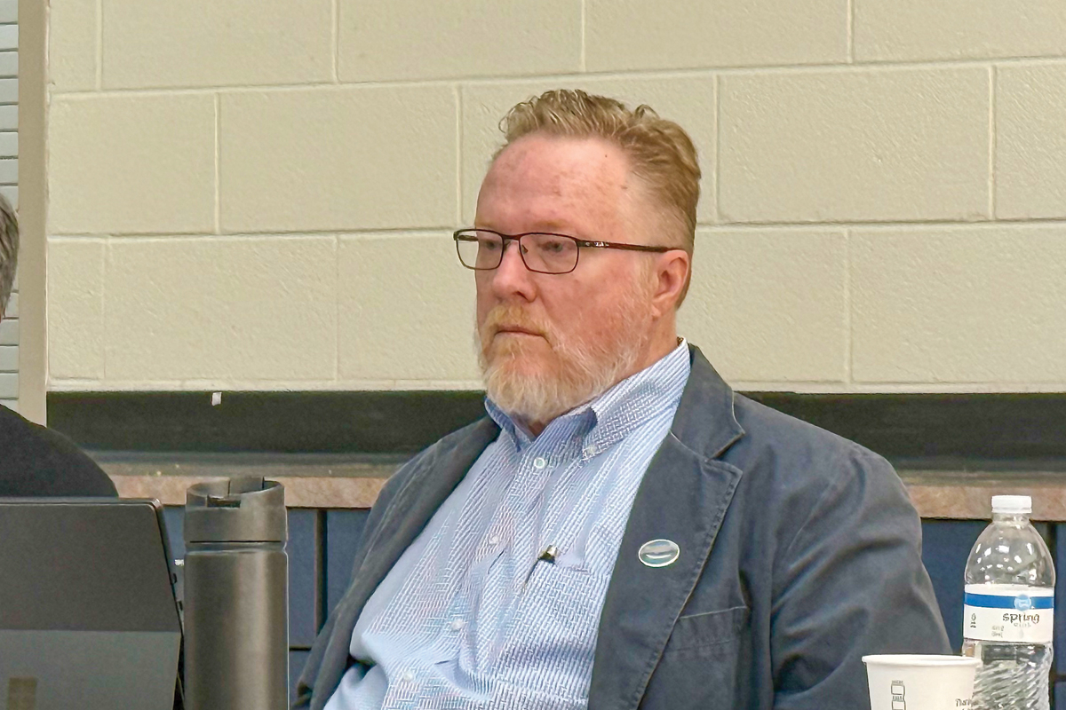Jon Feichter, a member of the Waynesville Town Council,listens to a presentation on salaries at the town’s annual budget retreat. 