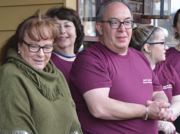 DWA Executive Director Buffy Phillips (left) joins pizzeria owner Danny Mannlein for the opening of his new Main Street restaurant. Cory Vaillancourt photo