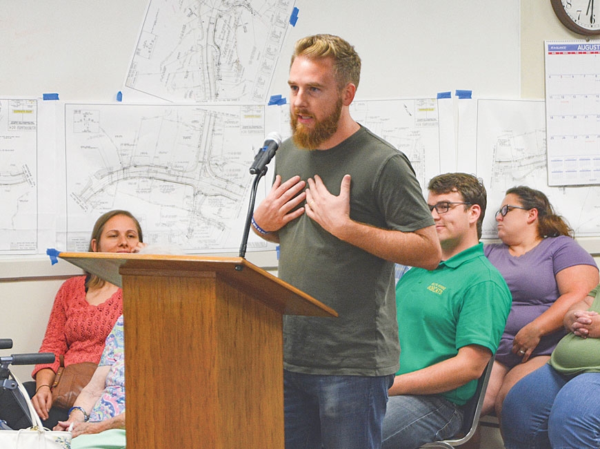 Cory Coleman of O’Malley’s Pub and Grill speaks against the road plan during an Aug. 8, 2019, Sylva town meeting. Holly Kays photo