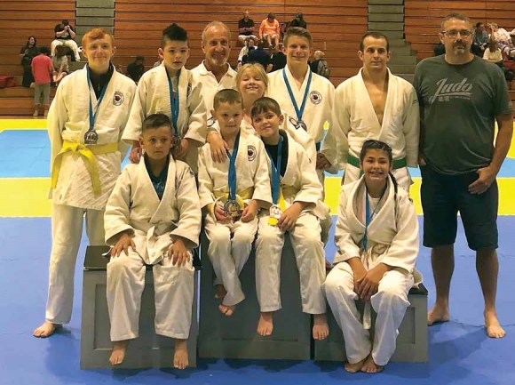 The Judo Club includes Mason Chambers, (front row left to right) Mason Early, Dessa Phillips, Tanner Keener and Shawnee Kirkland, and Mason Keener, (back row left to right) Parker Kirkland, Sensei Jimmy Riggs, Logan Grasty, Ryan Conn and Coach Rodney Phillips. Not pictured is Blake Sequoyah. Donated photo