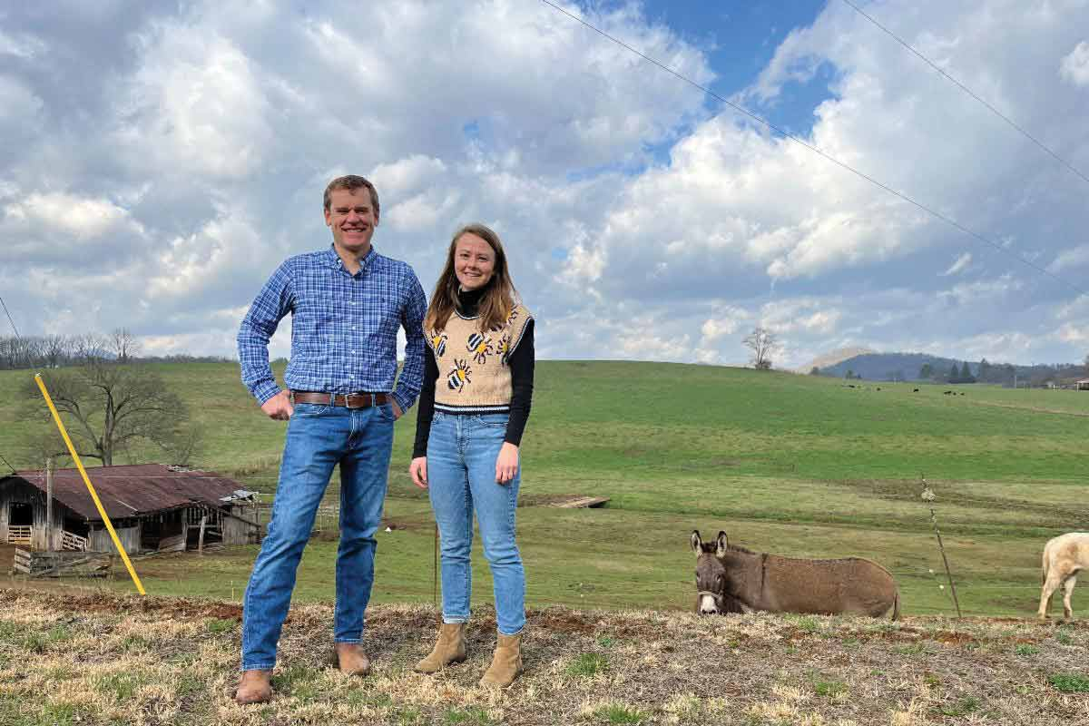 Executive Director Jordan Smith (left) and Land Conservation Manager Emmie Cornell stand in front of the newly acquired property at Historic Watauga Town. Mainspring photo