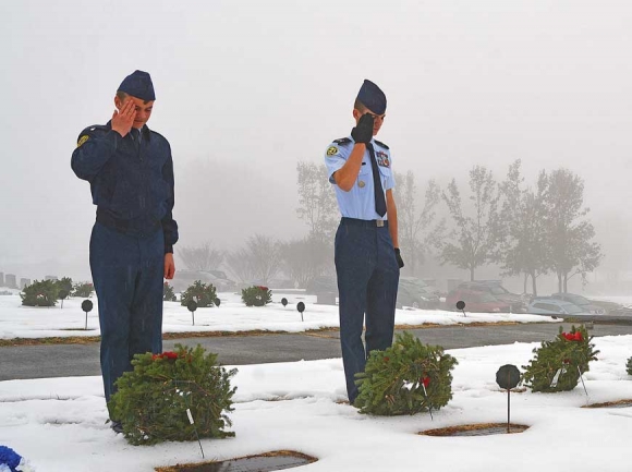 Cadets from the Tuscola High School AFJROTC place wreaths in Green Hill Cemetery the morning of Dec. 16. Cory Vaillancourt photo