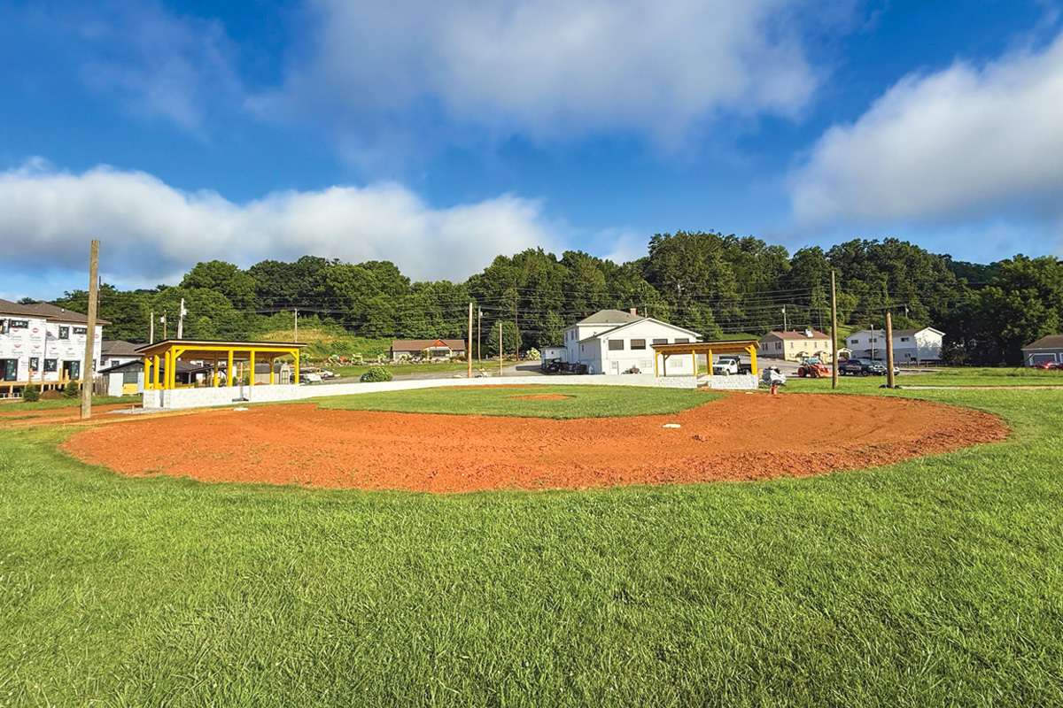 As seen in this photo from the outfield, the diamond looks better but still needs some minor work.