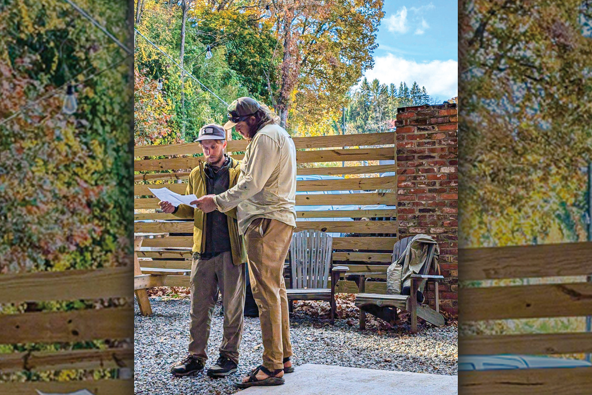 Thomas Grimes (left) and Doug EcElvey (right) going over route plans at the Canton shop. Donated photo