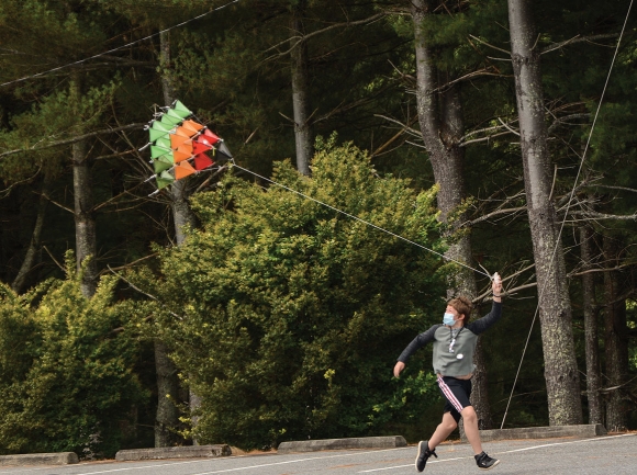 A camper tests out the tetrahedral kite he’d tinkered with throughout the two-week camp. Holly Kays photo