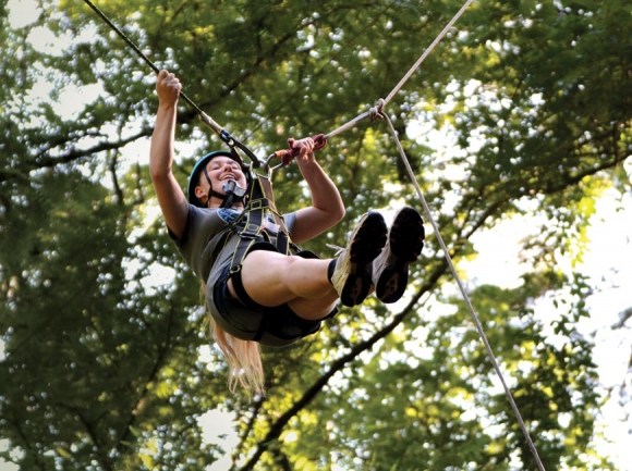 A camper prepares to release herself from the anchor to take an adrenaline-inducing ride on the ‘swing’ at Nantahala Outdoor Center. Holly Kays photos