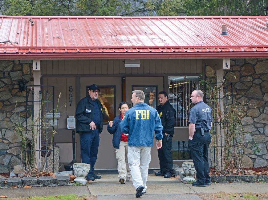 FBI agents raid the Qualla Housing Authority building in February 2017. Holly Kays photo
