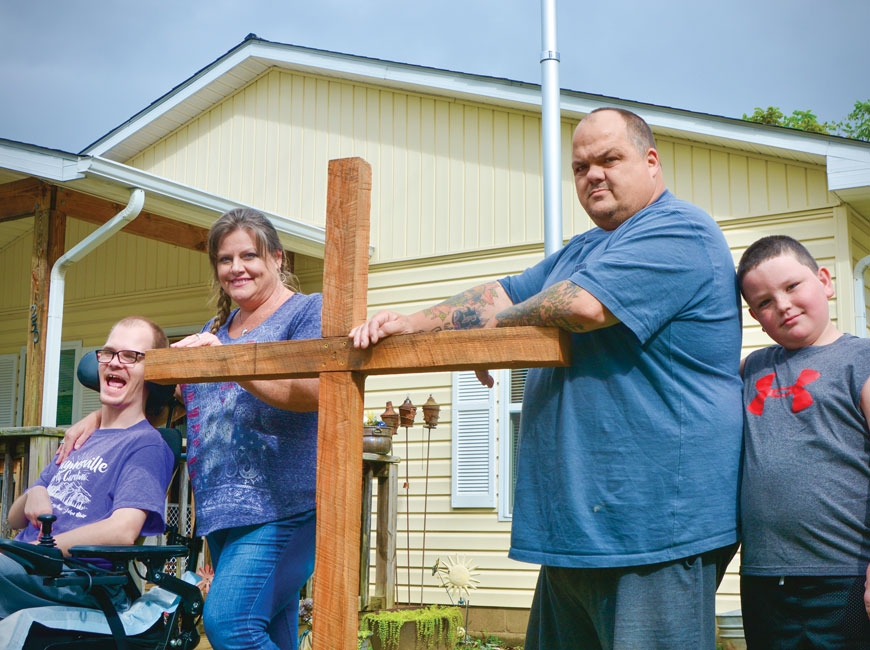 The Barnette family (left to right) Joshua, DJ, Darrell and Zander, stand outside their Hazelwood home. Cory Vaillancourt photo