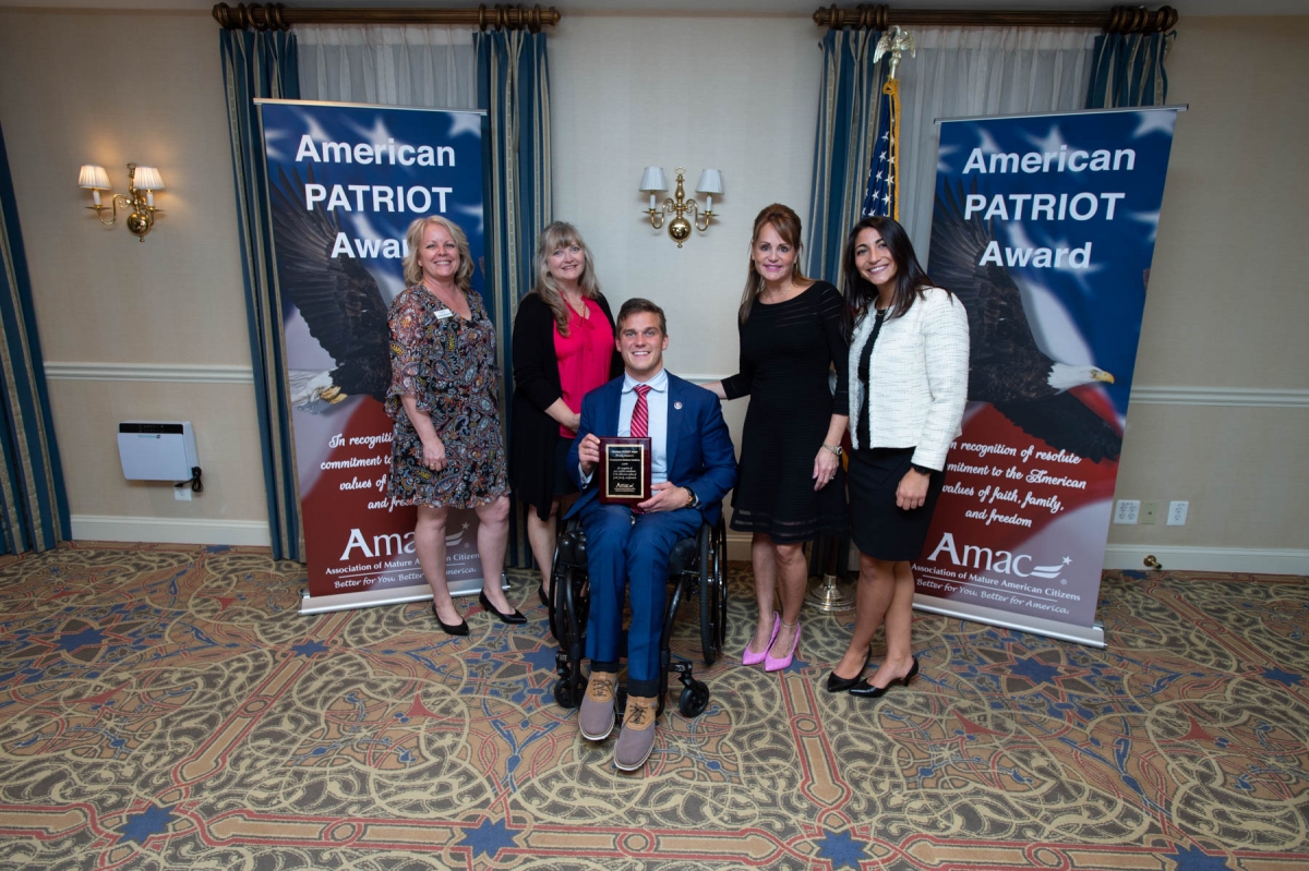 Congressman Madison Cawthorn accepts the American PATRIOT Award from AMAC CEO Rebecca Weber on Capitol Hill 
