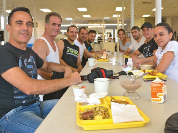 Members of the Kyrenia Youth Centre Association enjoy breakfast at Folkmoot July 23. Cory Vaillancourt photo