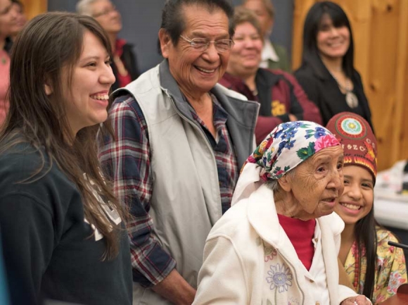 Amanda Swimmer stands surrounded by family after she is named a Beloved Woman in February. Holly Kays photo 