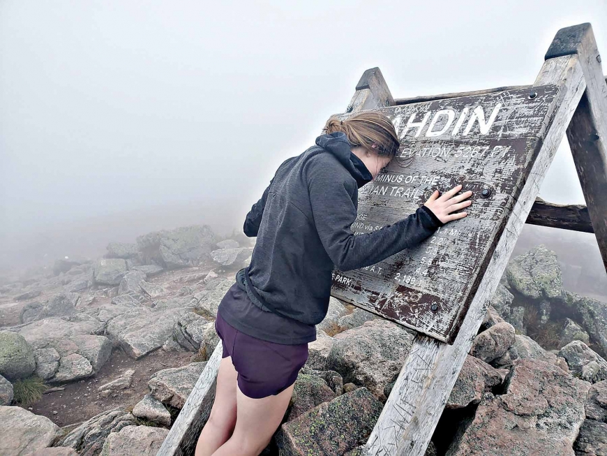 Karly Jones takes a moment to reflect after summiting Mount Katahdin.