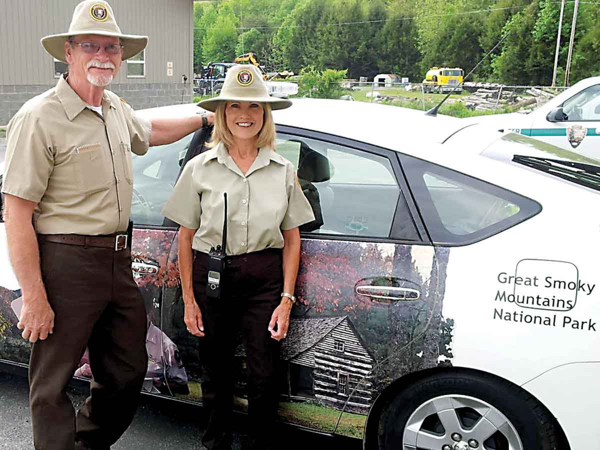 Roadside Assistance Volunteers stand beside their duty vehicle. NPS photo