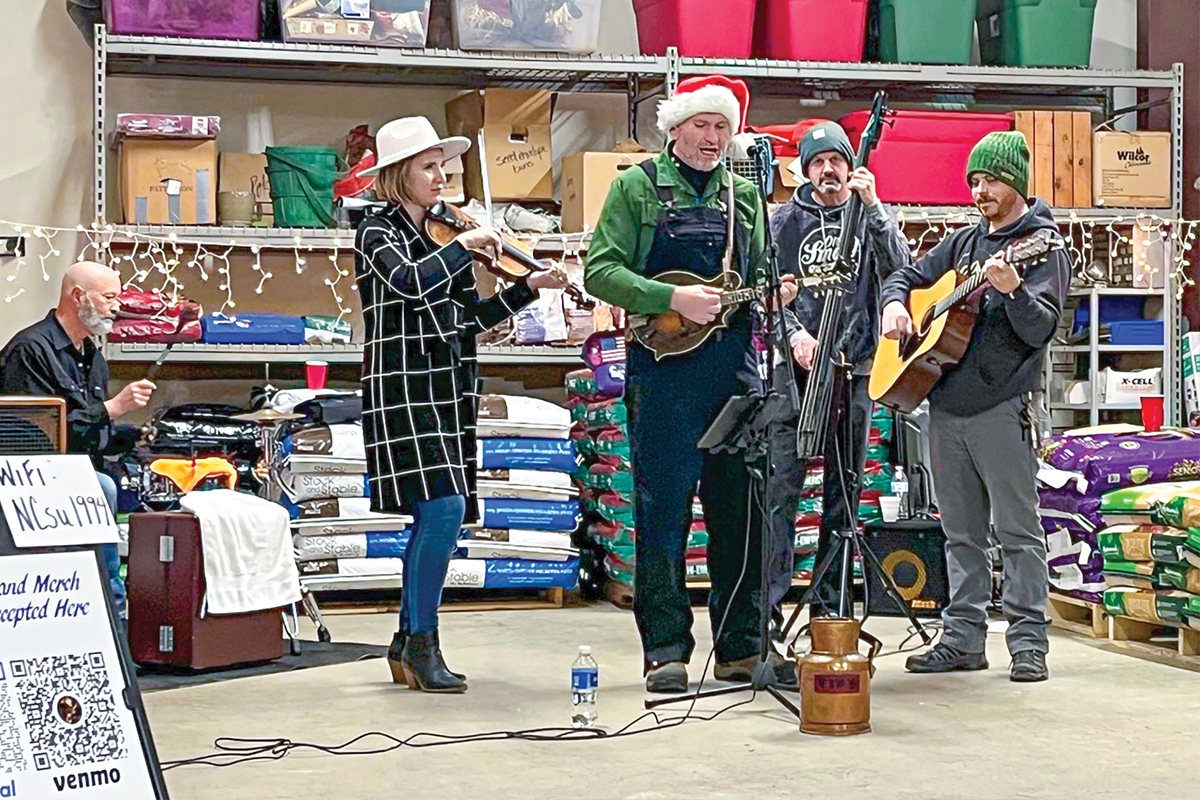 Darren Nicholson played at the Tuckasegee Trading Company, with band members Richard Foulk and Aynsley Porchak to his left, Kevin Sluder and Avery Welter to his right. Becky Kornegay photo 