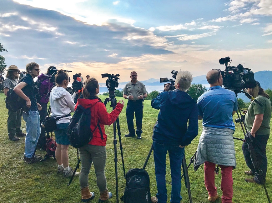 Greg Shuping (center) briefs media outlets during the July 2019 search for Kevin Lynch in National Park lands near The Swag. Lynch was ultimately found safe after a five-day search. Donated photo