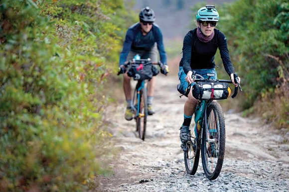 A pair of cyclists cruise WNC trails riding bikes outfitted with parts made by Asheville-based company Industry Nine.
