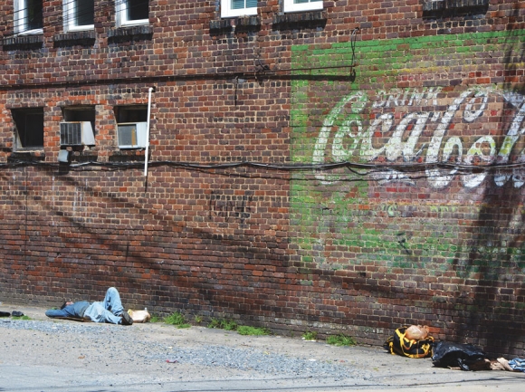 A man takes a nap in an alley in Frog Level on the afternoon of April 18. Cory Vaillancourt photo