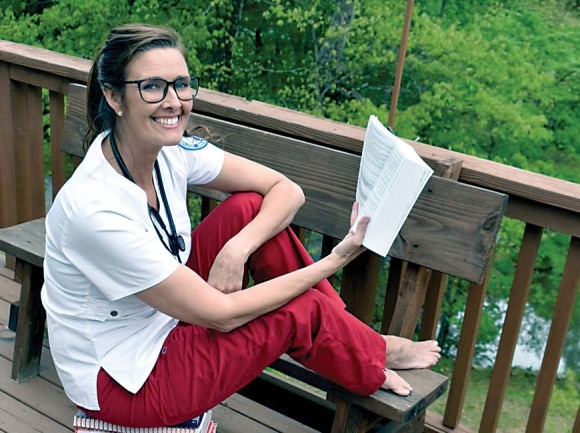 With in-person classes and clinicals canceled, nursing student Stephanie Morton adopts the deck as her new office. Donated photo