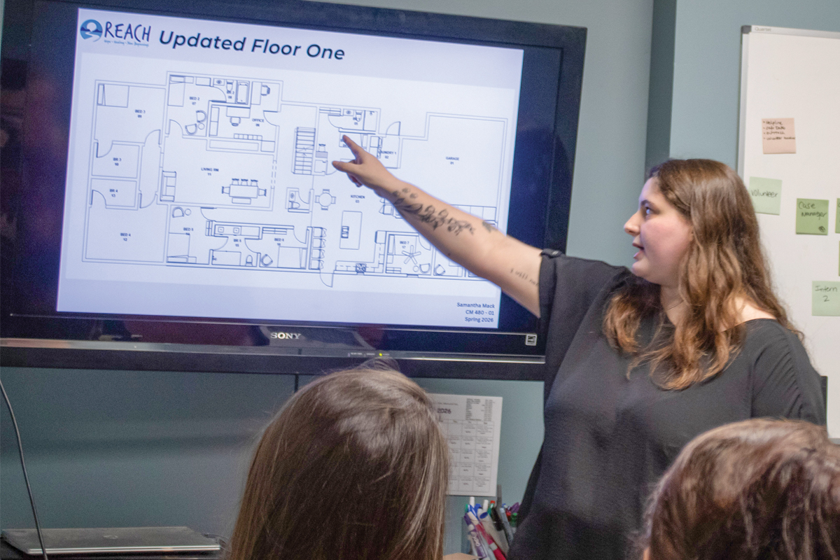 WCU student Samantha Mack shares design plans with project partners. 