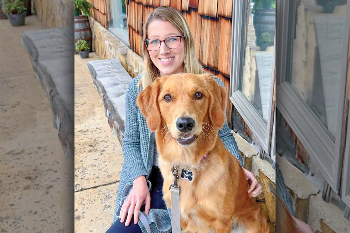 Sarah Kihn, REACH of Haywood County’s Development Coordinator, and her dog Luna. 