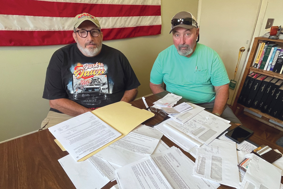 Mike Holland (left) and Dean Trull are just two of many former mill workers who had trouble with their health care coverage. Cory Vaillancourt photo