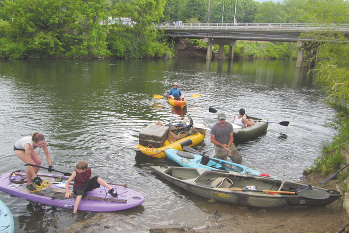 Volunteers pick up trash during a previous cleanup. Donated photo