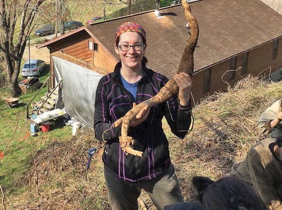 Reporter Holly Kays holds up her freshly dug kudzu root. Donated photo