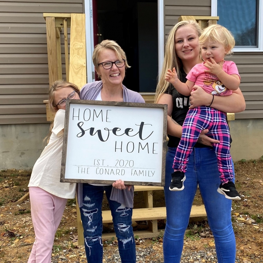 The Conards celebrate the dedication of their new Habitat home