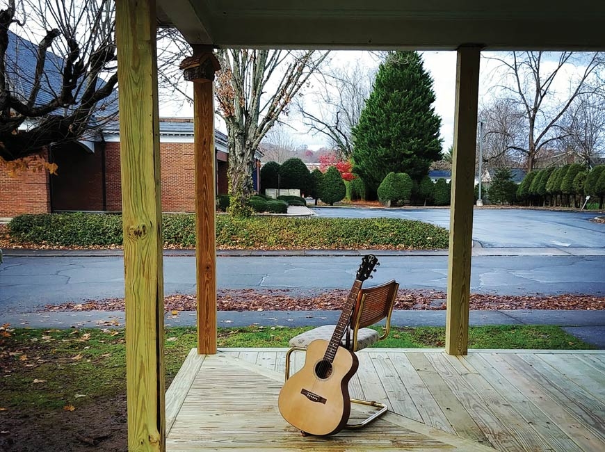 Guitar strumming on the new porch. (photo: Garret K. Woodward) 