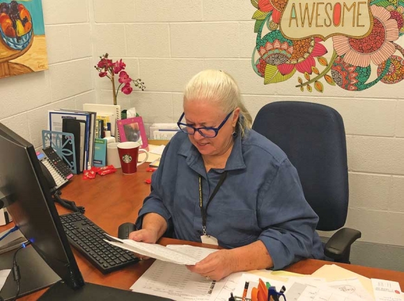 CJ Deering, a peer support specialist inside the Haywood County Detention Center, reads a letter from a former inmate now serving a prison sentence. Jessi Stone photo