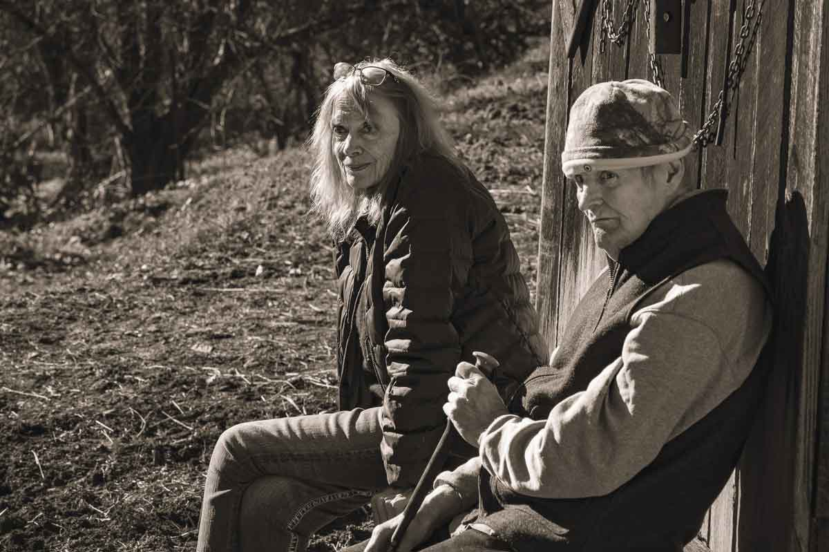 Elizabeth and George Ellison sit outside their home at lower Lands Creek. Mainspring photo