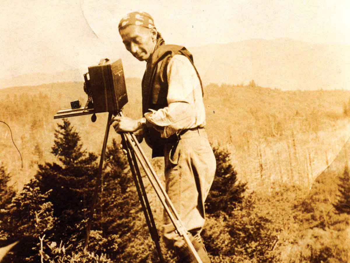 George Masa sets up his camera during a 1931 trip to what is now the Shining Rock Wilderness. GSMA photo 