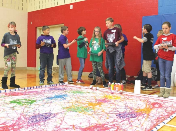 Fourth and fifth grade AIG students from across Haywood County compete in teams at the inaugural Wolfpack Robothon. Robots were used to paint a large canvas at one of the day’s most popular activities. Donated photo