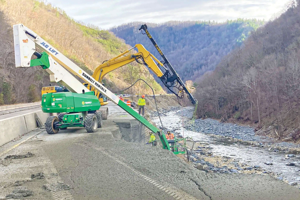 The rain-swollen Pigeon River eroded the base of I-40 lanes through the Pigeon River Gorge during Tropical Storm Helene last September. The NCDOT and its contractors have had to rebuild the embankment to get travel lanes back open. 