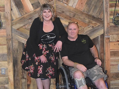 Celeste Ybanez and her father Clark Williams, owners of Frog Level Brewing Company, show off the new door to their new kitchen — The Canteen. Jessi Stone photo