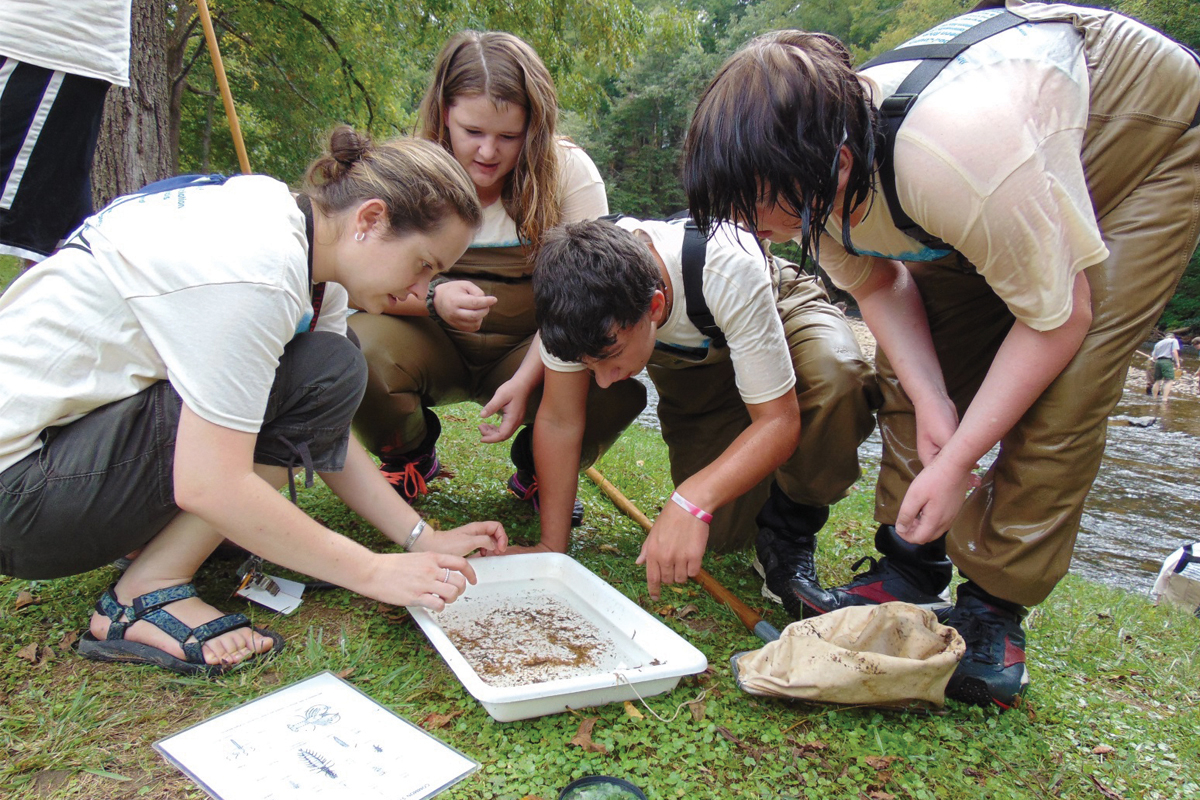 Eighth-graders check out aquatic creatures during the annual Kids in the Creek event. HWA photo