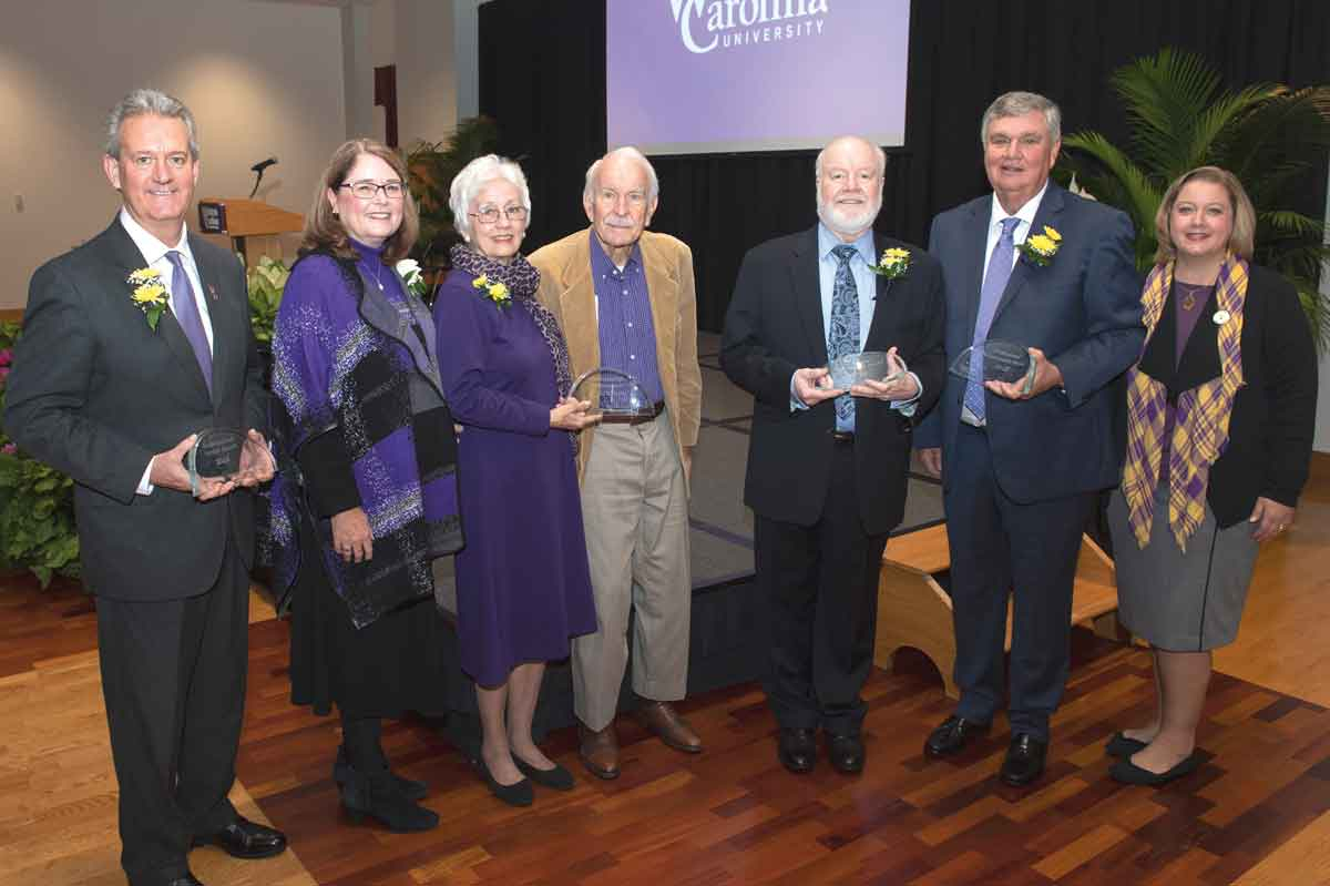 From left, Distinguished Service Award winner Marty Ramsey, Chancellor Kelli R. Brown, Distinguished Service Award winners Connie and Phil Haire, Alumni Association award winners Allen Queen and Paul Johnson, and Jamie T. Raynor, vice chancellor for advancement.
